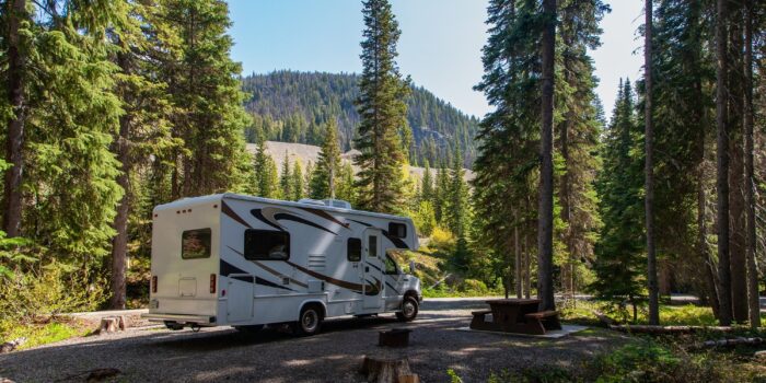Beautiful campsite mountains with rv wooden bench (1)
